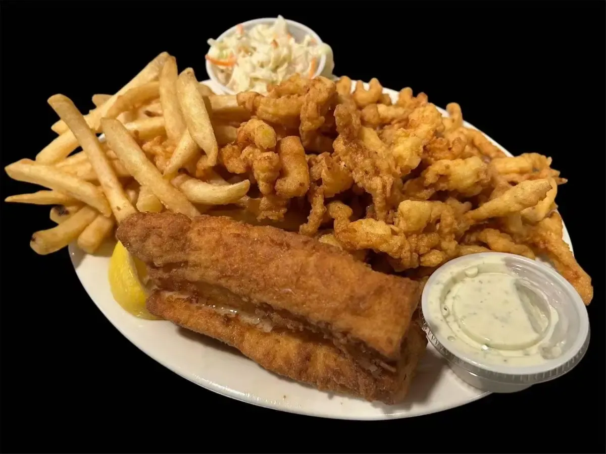 Fried fish and fried clams with french fries, coleslaw and tartar sauce